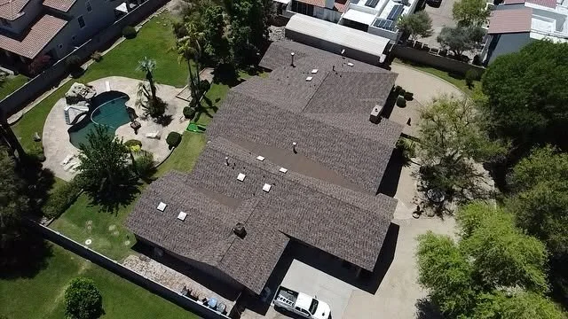 Metal roof flashing repair at wall chimney transitions in Deltona FL